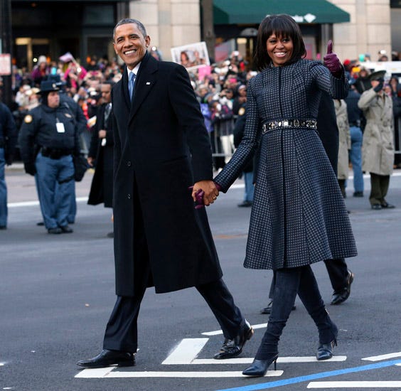 President Barack Obama and first lady Michelle Obama walk down Pennsylvania Avenue in Washington, Monday, Jan. 21, 2013, during the Inaugural Parade after his ceremonial swearing-in on Capitol Hill during the 57th Presidential Inauguration. (Doug Mills | Pool | Associated Press)