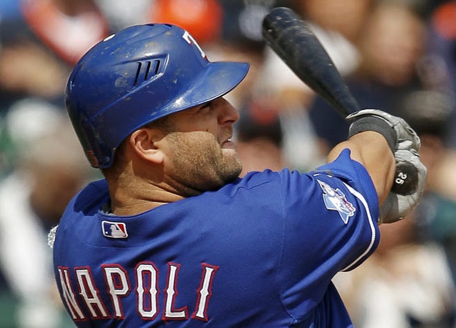 FILE - In this April 21, 2012, file photo, Texas Rangers' Mike Napoli hits a solo home run against the Detroit Tigers in the ninth inning of a baseball game in Detroit. Napoli and the Red Sox have finalized a one-year contract after a multiyear deal fell through because of health concerns.