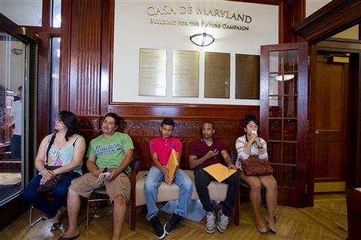 FILE - This Aug. 15, 2012 file photo shows applicants waiting in Casa de Maryland in Langley Park, Md., before they can apply for the Deferred Action Childhood Arrivals, as the U.S. started accepting applications to allow them to avoid deportation and get a work permit _ but not a path to citizenship. More than 6 in 10 Americans now favor allowing illegal immigrants to eventually become U.S. citizens, a major increase in support driven by a turnaround in Republicans' opinion after the 2012 elections. The finding, in a new Associated Press-GfK poll, comes as Republicans seek to increase their meager support among Latino voters, who turned out in large numbers to help-re-elect President Barack Obama in November.