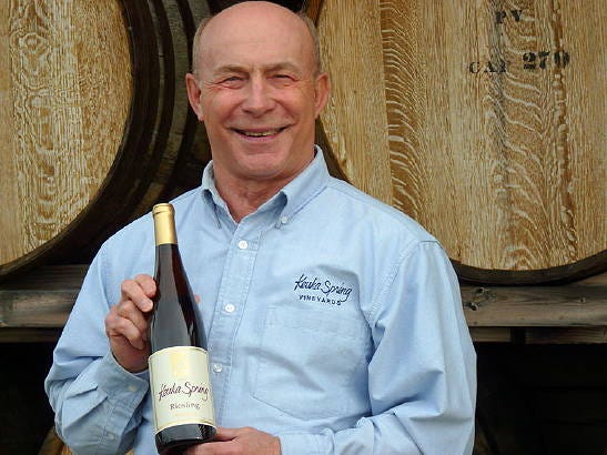 Len Wiltberger, owner of Keuka Spring Vineyards, holds a bottle of their 2011 Riesling awarded Best White Wine.