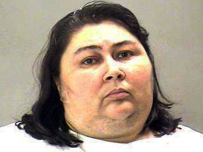 This undated file booking photo provided by the Dallas County Sheriff Department shows Tina Marie Alberson, 44. Alberson, convicted of injury to a child, was sentenced Tuesday to 85 years in prison in the 2011 dehydration death of her 10-year-old stepson whom she denied of water for days during record-high temperatures.