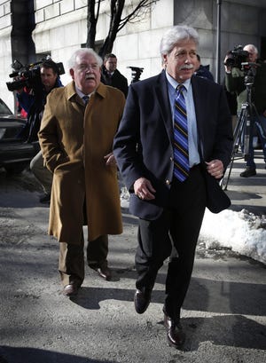 Mark Strong Sr., right, and his attorney, Dan Lilley, leave the Cumberland County Court House, Friday, Jan. 18, 2013, in Portland, Maine. No plea was reached Friday and the case will proceed to trial next week for Strong, the business partner of a Zumba dance instructor charged with running a prostitution business from her Kennebunk, Maine studio. Justice Nancy Mills declined to let the defense lawyer remove himself from representing Strong.(AP Photo/Robert F. Bukaty)