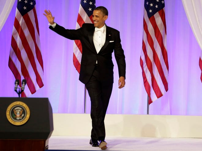 President Barack Obama arrives at the Commander-in-Chief's Inaugural Ball in Washington, at the Washington Convention Center during the 57th Presidential Inauguration on Monday, Jan. 21, 2013.