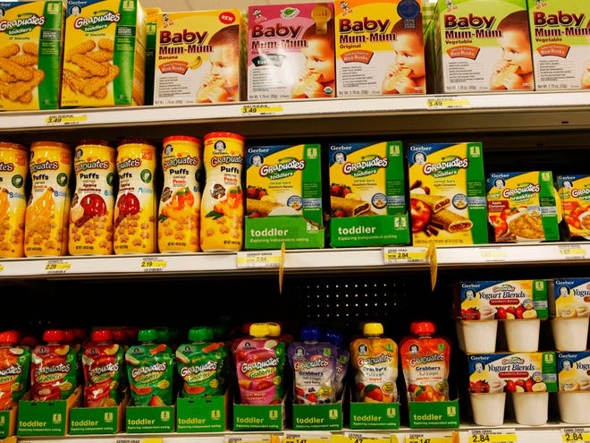 Gerber Graduates Grabbers squeezable fruit or fruit/vegetable pouches made with natural fruits and vegetables sit on the shelf next to other baby food products in the baby food aisle in City Target in downtown Los Angeles. Though they can be more expensive, pouches are beloved by parents who can let their kids feed themselves at a young age. (AP)