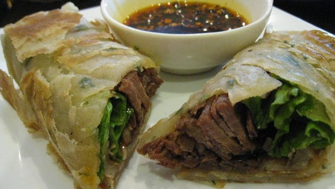 You can order the green onion pancakes, but for a treat, try the roast beef rolls, which are thin slices of beef rolled in a green onion pancake and served with a dipping sauce.