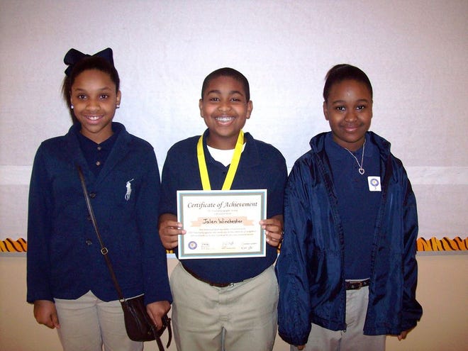 Pictured from left to right are the school level winners at Lowery Middle School: 2nd Place Winner, Reana Sullivan; School Champion, Jalen Winchester; 3rd Place Winner, Ta’Kia Mollere