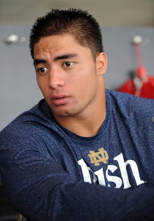 Notre Dame linebacker Manti Te'o answers a question during NCAA college football media day on Aug. 16, 2012, in South Bend, Ind. Te'o has told Katie Couric that he briefly lied about his online girlfriend after discovering she didn't exist, while maintaining that he had no part in creating the hoax.