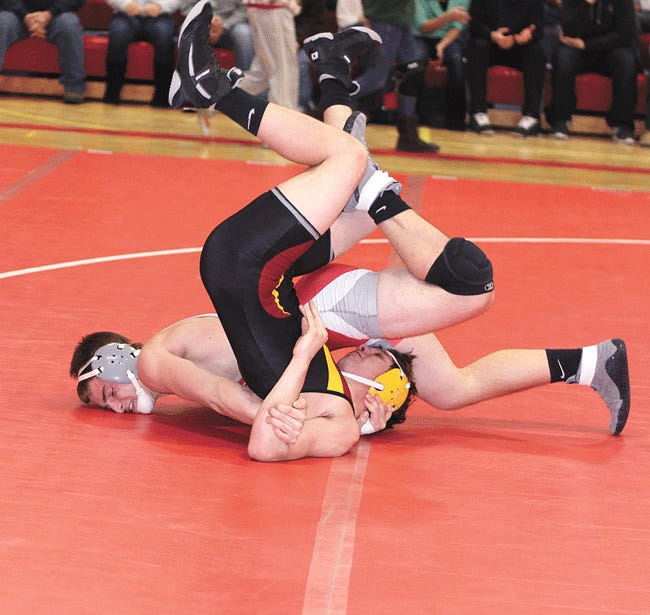 Constantine's Tommy Reed records a pin during the Falcons match with Galesburg-Augusta Wednesday night.