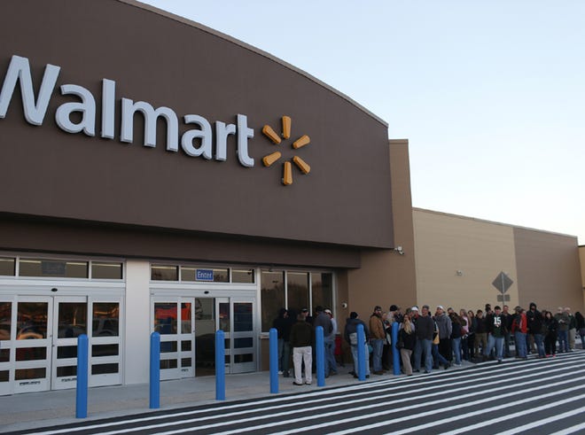 A crowd forms a line in front of the Wal-Mart on 23rd Street before the grand opening in Panama City on Wednesday.