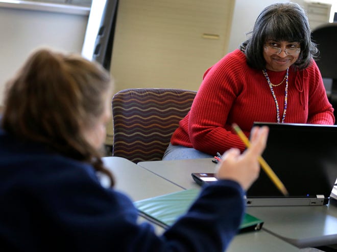 Caseworker Cheryl Boone listens to a client during a therapy session Wednesday at the Johnson County Mental Health Center in Shawnee, Kan. Lawmakers across the nation are rethinking cuts in mental health care spending in the wake of recent shootings.