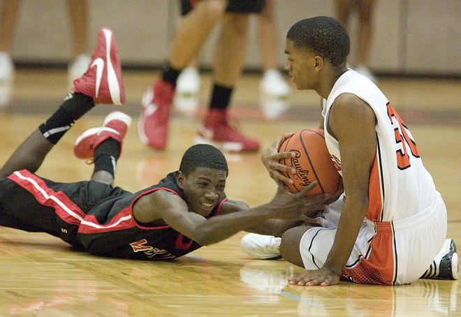 McKinley's Cortez Andrews left and Hoover's Nick Evans fight for a loose ball.