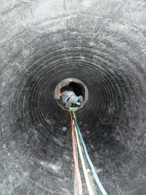 A firefighter from the Norfolk County Technical Rescue Team trains for trench and confined space rescue.
