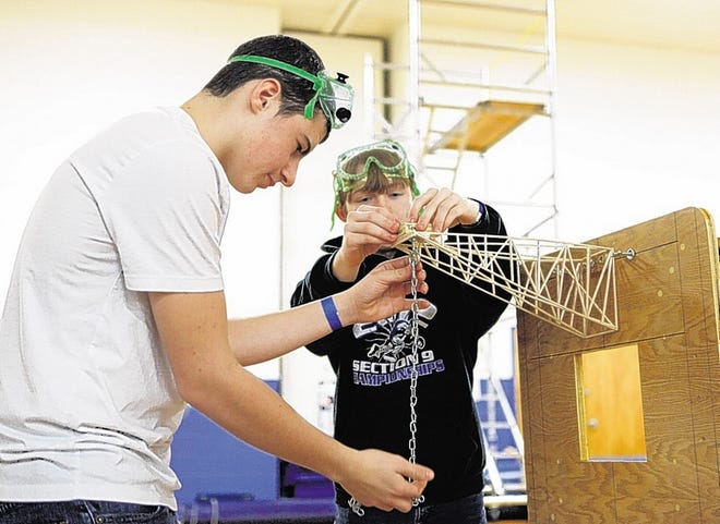 Ellenville High School junior David Lonstein, left, and sophomore Joe Smith prepare for the boomilever event during the Science Olympiad regional competition Saturday at SUNY Ulster.