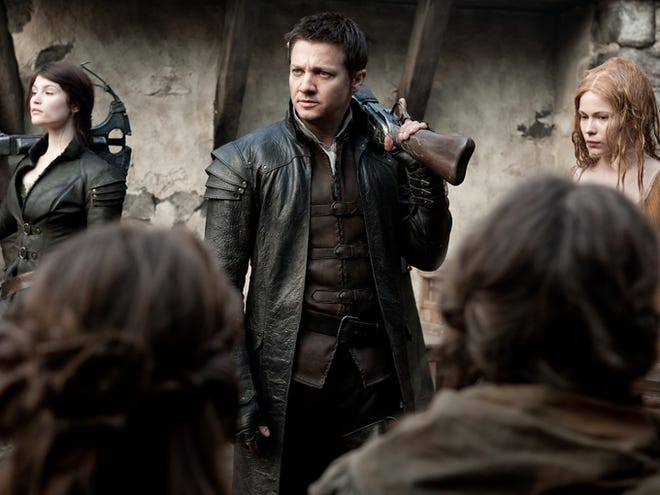 Gemma Arterton appears as Gretel, from left, Jeremy Renner as Hansel and Pihla Viitala as Mina in a scene from "Hansel & Gretel: Witch Hunters."