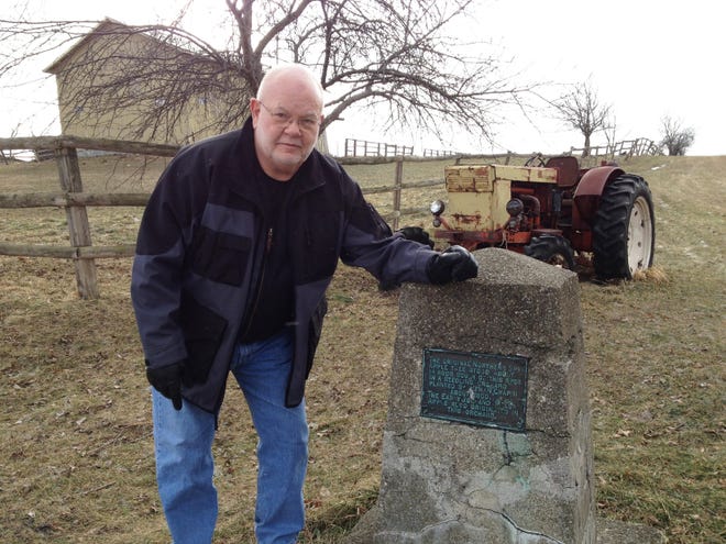 Jim Lyon, a member of the East Bloomfield Historical Society, at the monument to the place of origin for the Northern Spy apple in about 1800.