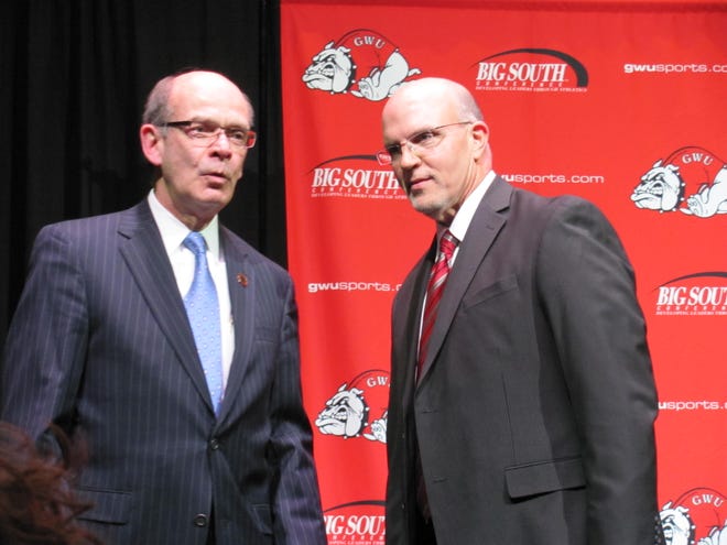 Alan Ford / The Star

New Runnin' Bulldog football coach and alumnus Carroll McCray (Class of '83) talks with GWU President Dr. Frank Bonner after Monday's press conference at the Tucker Student Center.