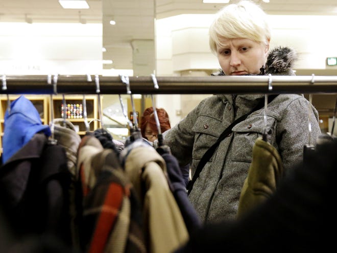A woman shops at a Nordstrom store on Jan. 20 in Chicago. U.S. consumer confidence plunged in January to its lowest level in more than a year, reflecting higher Social Security taxes that left Americans with less take-home pay.