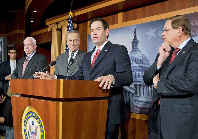 A bipartisan group of leading senators announces Monday that it has reached agreement on the principles of sweeping legislation to rewrite the nation’s immigration laws during a news conference at the Capitol in Washington. From left are Sen. John McCain, R-Ariz., Sen. Charles Schumer, D-N.Y., Sen. Marco Rubio, R-Fla., and Sen. Robert Menendez, D-N.J. AP PHOTO