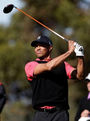 Tiger Woods watches his tee shot on the 10th hole during the fourth round of the Farmers Insurance Open golf tournament at the Torrey Pines Golf Course, Monday, Jan. 28, 2013, in San Diego. (AP Photo/Gregory Bull)