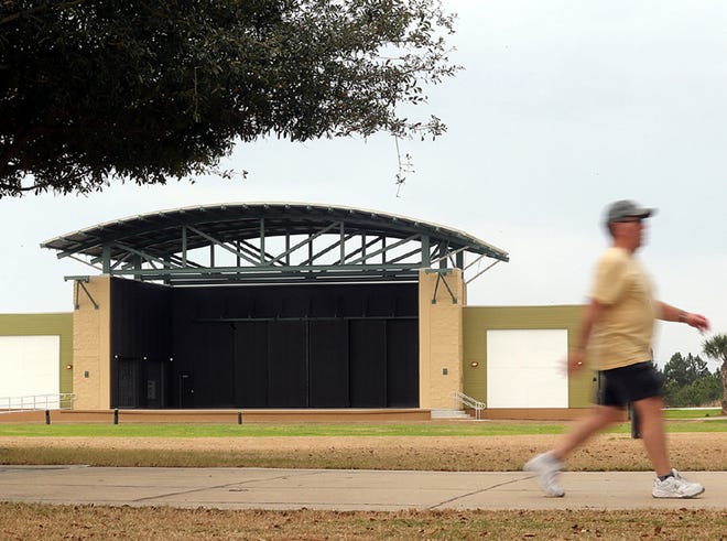 A man walks past the new amphitheater at Aaron Bessant Park in Panama City Beach on Tuesday. The first major event at the amphitheater, located west of Pier Park, most likely will begin in the spring, with the Seabreeze Jazz Festival scheduled for April 17-21.