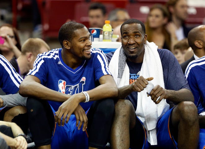 Oklahoma City Thunder's Kevin Durant, left, and Kendrick Perkins smile as the relax on the bench in the closing moment of an NBA basketball game against the Sacramento Kings in Sacramento, Calif., Friday, Jan. 25, 2013. The Thunder won 105-95. (AP Photo/Rich Pedroncelli) ORG XMIT: SCA115
