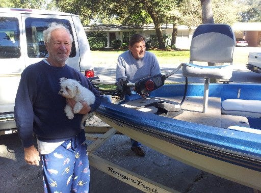 Mancell Boyd, his dog Sassy and his friend Don Weita were back on dry land Thursday recounting their harrowing experience in Weita's bass boat Wednesday.