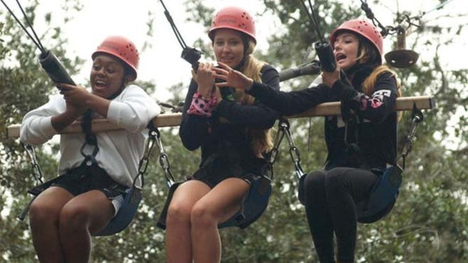 Taking on the zip line during their three-day retreat at Southwind Camp in Ocklawaha are The King’s Academy seniors (from left) Eve Kankam, Brooke Griggs and Paulina Rodriguez. The purpose of the retreat was to strengthen class unity while challenging students in leadership skills and spiritual commitment.