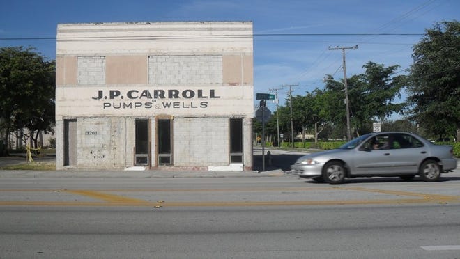 When the former American Legion Post 12 building at 3201 S. Dixie Highway was being renovated in December, it revealed the building’s former manifestation as J.P. Carroll Pumps & Wells. (Photo by Eliot Kleinberg)