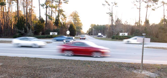 Drivers zoom past on U.S. 70 at the intersection of Carolina Pines Boulevard. The N.C. Department of Transportation has announced plans to change the intersection so drivers will no longer be able to make left turns in a move designed to increase safety.