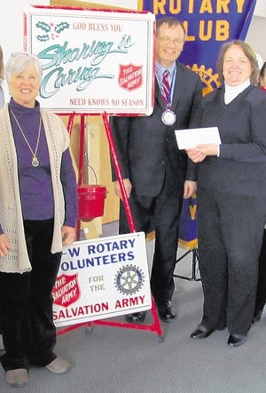 Salvation Army Maj. Mary Moore, right, visited the Monroe-Woodbury Rotary recently to thank the membership, led by Rotary president Gail Dejmal, left, for a project headed by Rotarian Bob Pollsen, second from right.