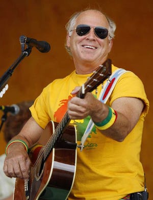 FILE - In this May 6, 2006 file photo, Jimmy Buffett performs at the 2006 New Orleans Jazz & Heritage Festival in New Orleans. Timing is not on Jimmy Buffett's side. The "Margaritaville" singer is synonymous with the white-sand beaches along the Gulf Coast that are now being fouled by leaked oil. He's planning to open a hotel in Pensacola Beach, Fla., in two weeks. (AP Photo/Alex Brandon, File)