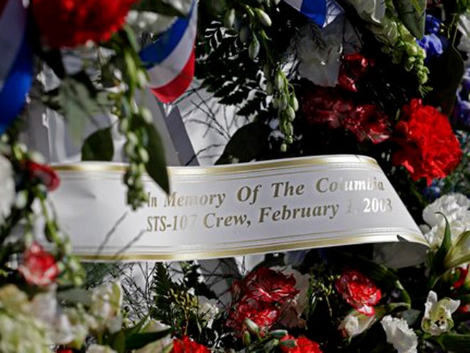 A wreath placed at the Space Mirror Memorial is seen during a remembrance ceremony on the 10th anniversary of the loss of space shuttle Columbia crew at the Kennedy Space Center Visitor Complex on Friday. (AP Photo/John Raoux)