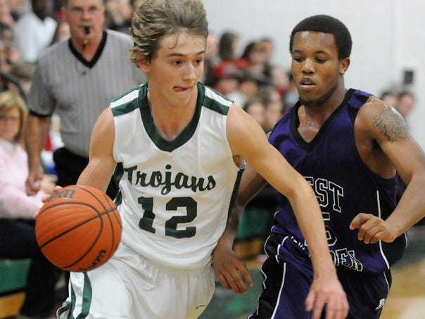 West Brunswick's Gray Cheers dribbles past West Bladen's Malcolm Wright during their game at West Brunswick on Friday, Feb. 1, 2013.