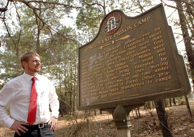 Terry.Dickson@jacksonville.com Tommy Lowmon, director of tourism and economic development for Blackshear, stands with a historical marker that is the only indication that a Confederate POW camp was located northwest of the city during Sherman's march through Georgia. Lowmon and some state officials would like an archaeological study of the site.