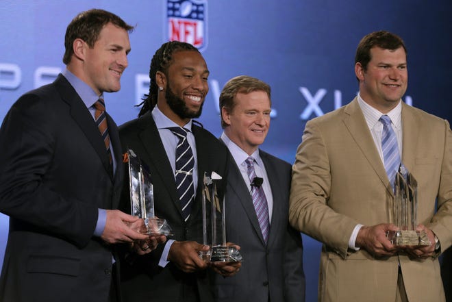NFL Commissioner Roger Goodell (second from right) poses with Walter Payton NFL Man of the Year finalists (from left) Jason Witten of the Dallas Cowboys, Larry Fitzgerald of the Arizona Cardinals and Joe Thomas of the Cleveland Browns on Friday in New Orleans.