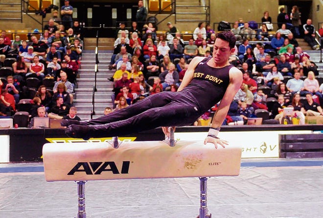 Jesse Glenn takes his turn on the pommel horse during the 2013 West Point Gymnastic Open at West Point Academy in West Point on Friday evening.