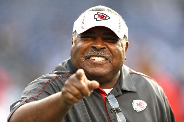 Kansas City Chiefs head coach Romeo Crennel points to a friend on the sidelines prior to the start of the NFL game between the Kansas City Chiefs and San Diego Chargers Thursday, Nov. 1, 2012 in San Diego. (AP Photo/Gregory Bull)