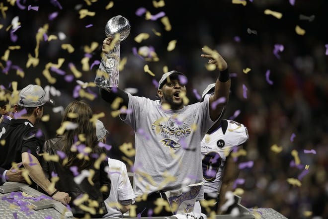 Baltimore Ravens linebacker Ray Lewis (52) shouts while holding the the Vince Lombardi Trophy after NFL Super Bowl XLVII football game against the San Francisco 49ers Sunday, Feb. 3, 2013, in New Orleans. The Baltimore Ravens won 34-31.