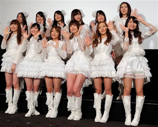 Group Of Girls Posing - Japan pop idol's head-shave apology stirs debate