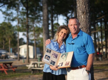 Connie and Jeff Spencer hold an album containing photos from their time together in school at the Camper's Inn campground on Monday, February 4, 2013, in Panama City Beach, Fla. The reunited childhood sweethearts plan to attend the winter resident senior prom.
