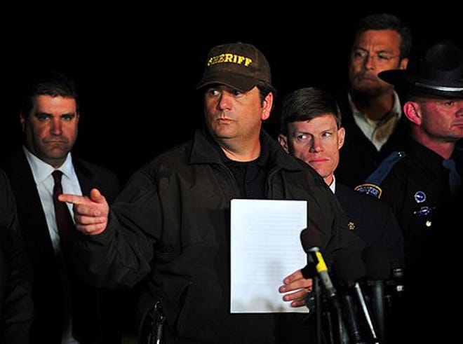 Dale County Sheriff Wally Olsen answers questions from the media about the close of the hostage crisis during a news conference late Monday, Feb. 4, 2013, in Midland City, Ala. Authorities stormed an underground bunker Monday in Midland City, freeing the 5-year-old boy and leaving his captor dead after a week of fruitless negotiations that left authorities convinced the child was in imminent danger.