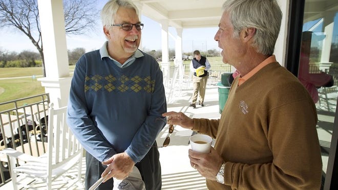 Gathered on the new veranda, golf course architect Jep Willie, left, chats with Austin pro golfer Ben Crenshaw last week during the grand re-opening ceremony for Morris Williams Golf Course. Crenshaw, who has twice won the Masters, began playing at Morris Wiliams shortly after the course opened in 1964 while Willie consulted on the recent renovations to the course.