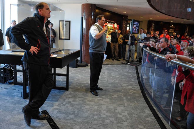 Georgia offensive coordinator Mike Bobo and defensive coordinator Todd Grantham speak with fans on National Signing Day on Wednesday at Butts-Mehre Heritage Hall. (AJ Reynolds/Staff)