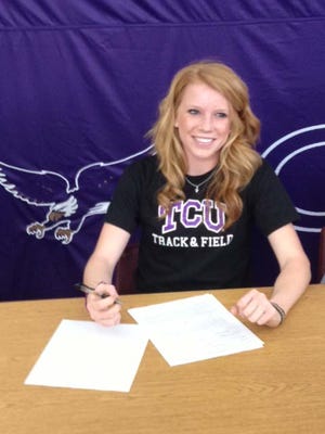Canyon High school track standout Arin Rice signs a national letter-of-intent to attend Texas Christian University on Wednesday morning at Canyon High School.