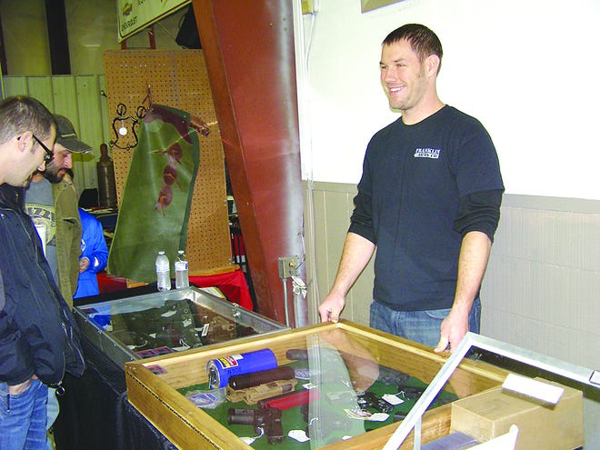 Strict rules were in place for the Gun and Knife Show at Mason-Dixon Auto Auction, but they did not deter the crowd. Cody Shank, Marion, served customers at the table for his business, Franklin Arms Co.