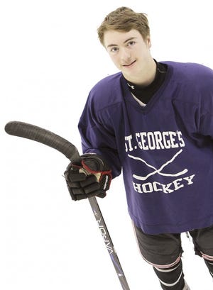 Center finds a balance. 
 Tim Doherty has learned how to manage his diabetes and his 
 responsibilities on the ice as the top scorer for the St. George’s School boys hockey team. 
 Photo by Jacqueline Marque