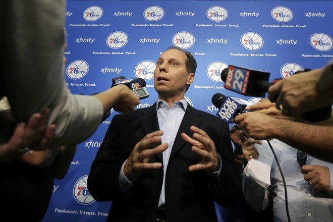 Sixers GM Tony DiLeo talks to reporters during a news conference.