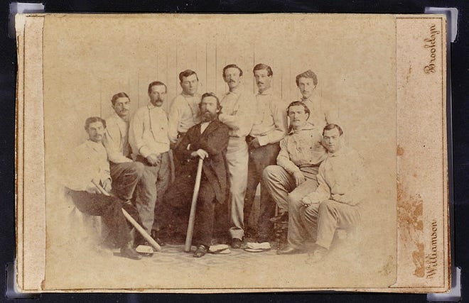 This undated file photo released Jan. 9 by the Saco River Auction Co., in Biddeford, Maine, shows a rare 1865 baseball card of the Brooklyn Atlantics, discovered in a photo album bought at a yard sale in Baileyville, Maine, on the Canadian border. The card has been auctioned for $92,000.