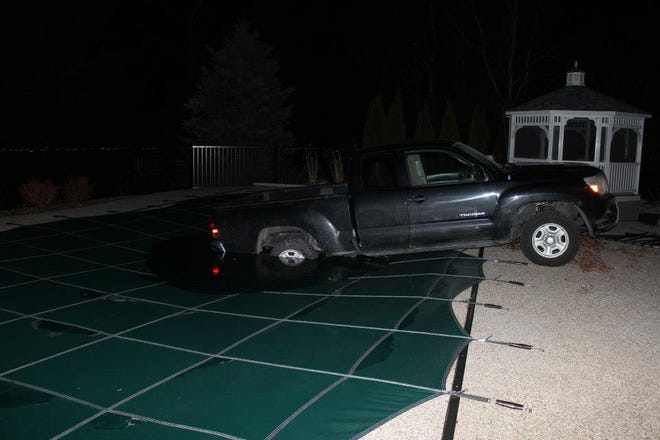 This 2006 Toyota Tacoma slipped out of gear and rolled down a hill on Ashley Road, narrowly missing a home before ending up in a pool at 6 Ashley Road. Courtesy Elizabeth Dill