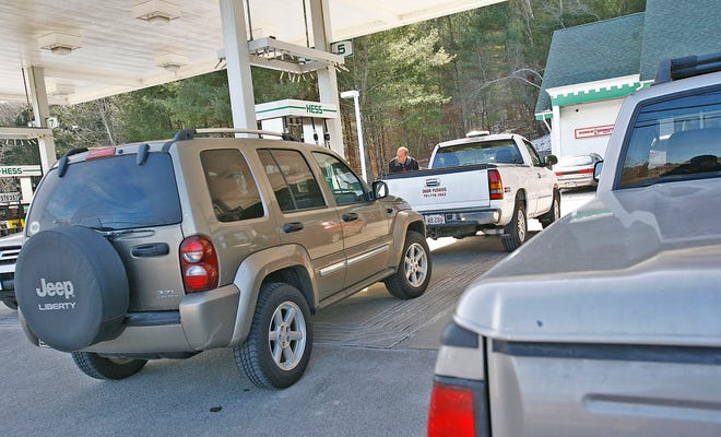 Driver line up to fill their gas tanks in Marshfield on Thursday Feb. 7, 2013 with the threat of a blizzard looming large for Friday and Saturday.The Hess gas station on Ocean Street.